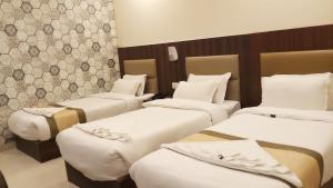 Postel nebo postele na pokoji v ubytování Hotel Saayein Residency