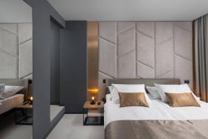 Postel nebo postele na pokoji v ubytování Terra Residence