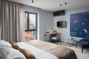 Postel nebo postele na pokoji v ubytování Terra Residence