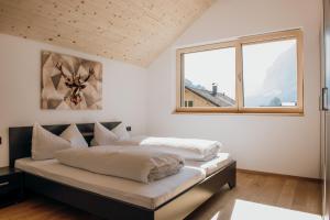 Posteľ alebo postele v izbe v ubytovaní hus56