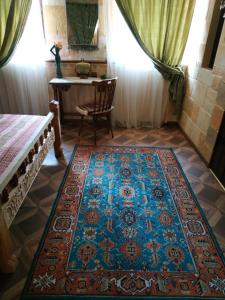 En eller flere senger på et rom på Hye Aspet Հայ Ասպետ