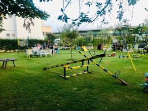 a park with a playground with people playing at Apartments Flamingo in Ulcinj