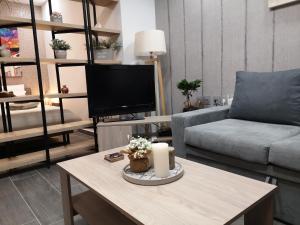 a living room with a couch and a coffee table at Apartment 22 in Alexandroupoli