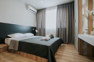 Posteľ alebo postele v izbe v ubytovaní Unique Experience Apartment’s