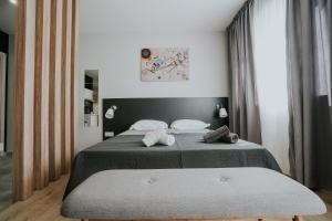Posteľ alebo postele v izbe v ubytovaní Unique Experience Apartment’s