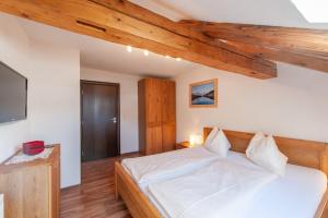 Postel nebo postele na pokoji v ubytování Gasthaus Traube