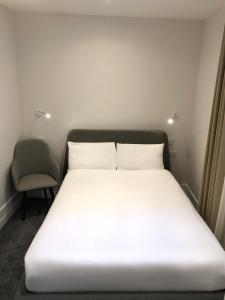Ένα ή περισσότερα κρεβάτια σε δωμάτιο στο Widegate Residential