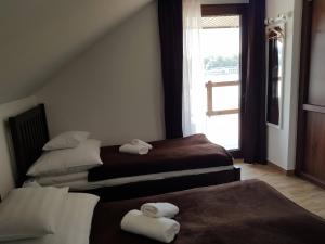 A bed or beds in a room at Duna Dráva Vendégház