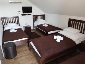 A bed or beds in a room at Duna Dráva Vendégház