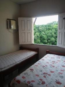 Een bed of bedden in een kamer bij Salinas-Casa em condominio com trapiche