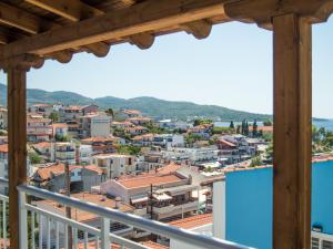 a view of a city from a balcony at House Charistos in Neos Marmaras