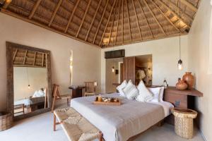 Postel nebo postele na pokoji v ubytování Hotel Ma'xanab Tulum