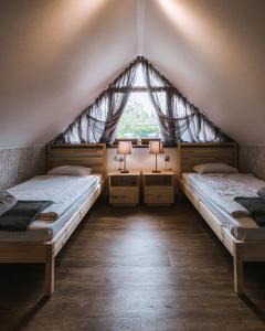 מיטה או מיטות בחדר ב-STACJA MAGURKA SKI&BIKE