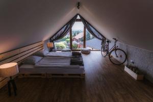A bed or beds in a room at STACJA MAGURKA SKI&BIKE