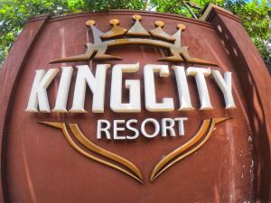 a sign for a nintendo resort with a crown on it at Kingcity Resort in Anuradhapura