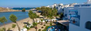 a view of a beach with trees and buildings at Asteria Hotel in Naxos Chora