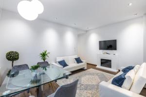 TV a/nebo společenská místnost v ubytování UBICACIÓN INMEJORABLE REFORMADO LUJO