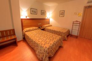 Postel nebo postele na pokoji v ubytování Hotel Torrezaf