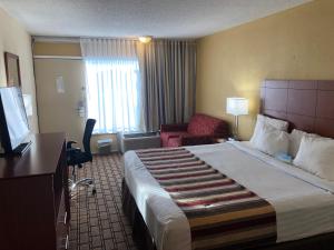 Kama o mga kama sa kuwarto sa Days Inn by Wyndham Natchez
