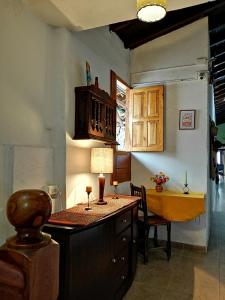 a kitchen with a island with a table with a lamp at Hotel Agualuna in San Gil