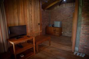 TV a/nebo společenská místnost v ubytování Gardenia Country Inn