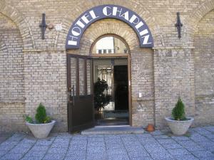 an entrance to a building with a sign that reads civil charity at Hotel Chaplin in Landskrona
