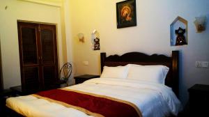 A bed or beds in a room at The Hotel