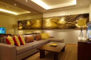 a living room with a couch and a table at Double - Six, Luxury Hotel - Seminyak in Seminyak