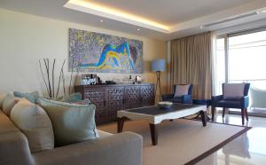 a living room with a couch and a table at Double - Six, Luxury Hotel - Seminyak in Seminyak