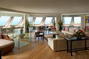 a living room with couches and tables in a building at Double - Six, Luxury Hotel - Seminyak in Seminyak