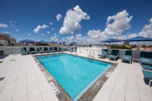 a swimming pool on the roof of a building at President Villa in Miami Beach
