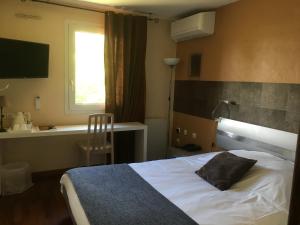 Postel nebo postele na pokoji v ubytování La Roselière