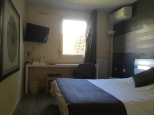 Postel nebo postele na pokoji v ubytování La Roselière