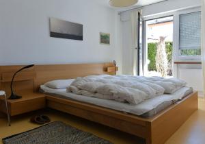 Postel nebo postele na pokoji v ubytování Apartment in Casa Caral - Flims Waldhaus