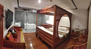 Postel nebo postele na pokoji v ubytování Qinfu Hotel Beijing Nanluogu Lane Houhai