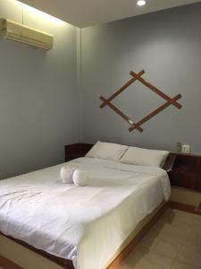 First Garden Home Resort tesisinde bir odada yatak veya yataklar