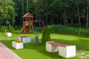 a park with a playground and a bench and a swing at ibis Moscow Domodedovo Airport in Domodedovo