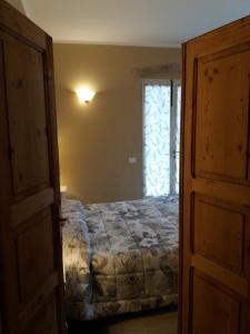 Postel nebo postele na pokoji v ubytování B&B Al Tramonto