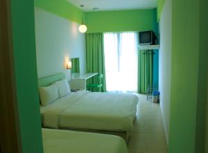 Postel nebo postele na pokoji v ubytování YY38 Hotel