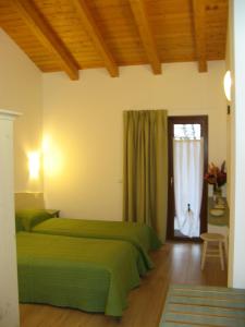 Un pat sau paturi într-o cameră la Bosco Romagno