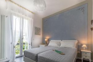 a bedroom with a large bed with a bird on it at Maji Como Lake in Mandello del Lario