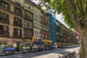 a city street with buildings and cars on the road at Arenal View by Forever Rentals in Bilbao
