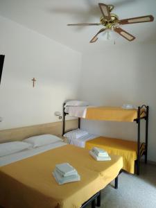 Postel nebo postele na pokoji v ubytování Hotel Niagara
