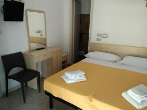 Postel nebo postele na pokoji v ubytování Hotel Niagara