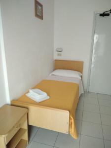 Postel nebo postele na pokoji v ubytování Hotel Niagara