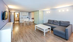 TV a/nebo společenská místnost v ubytování Triton Boutique Hotel