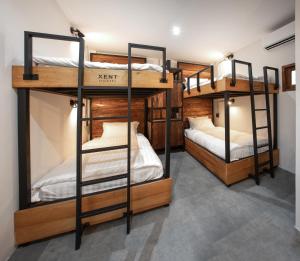 a room with two bunk beds in a hostel at J Jacuzzi Villa Ranong in Ranong +20 photos