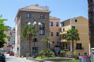 
a large building with a clock on the side of it at Casa Trezeni in Santa Maria di Castellabate
