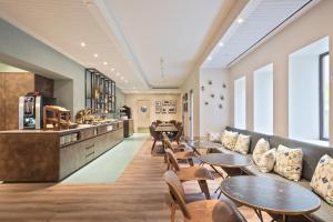 Posezení v ubytování Hotel Via Augusta