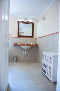a bathroom with a sink and a mirror at Casa Tresinus in Santa Maria di Castellabate